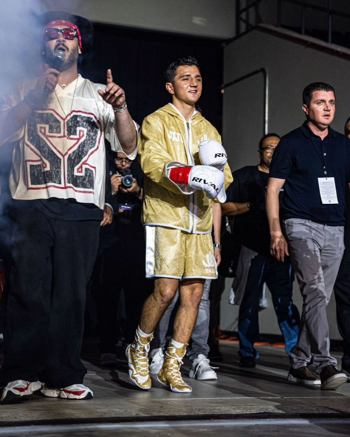 Julius Ballo walking to the ring in the gold robe